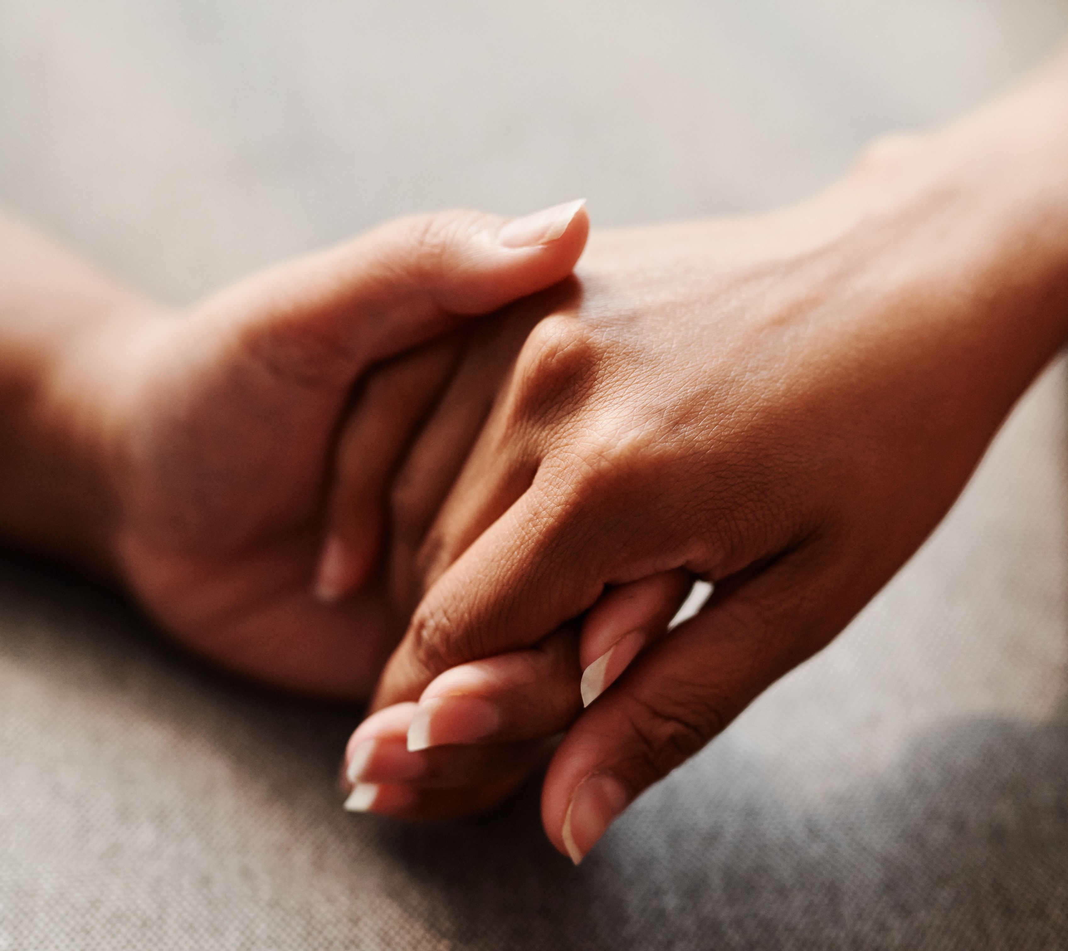 Hands held in support representing doula care resources in Victoria BC