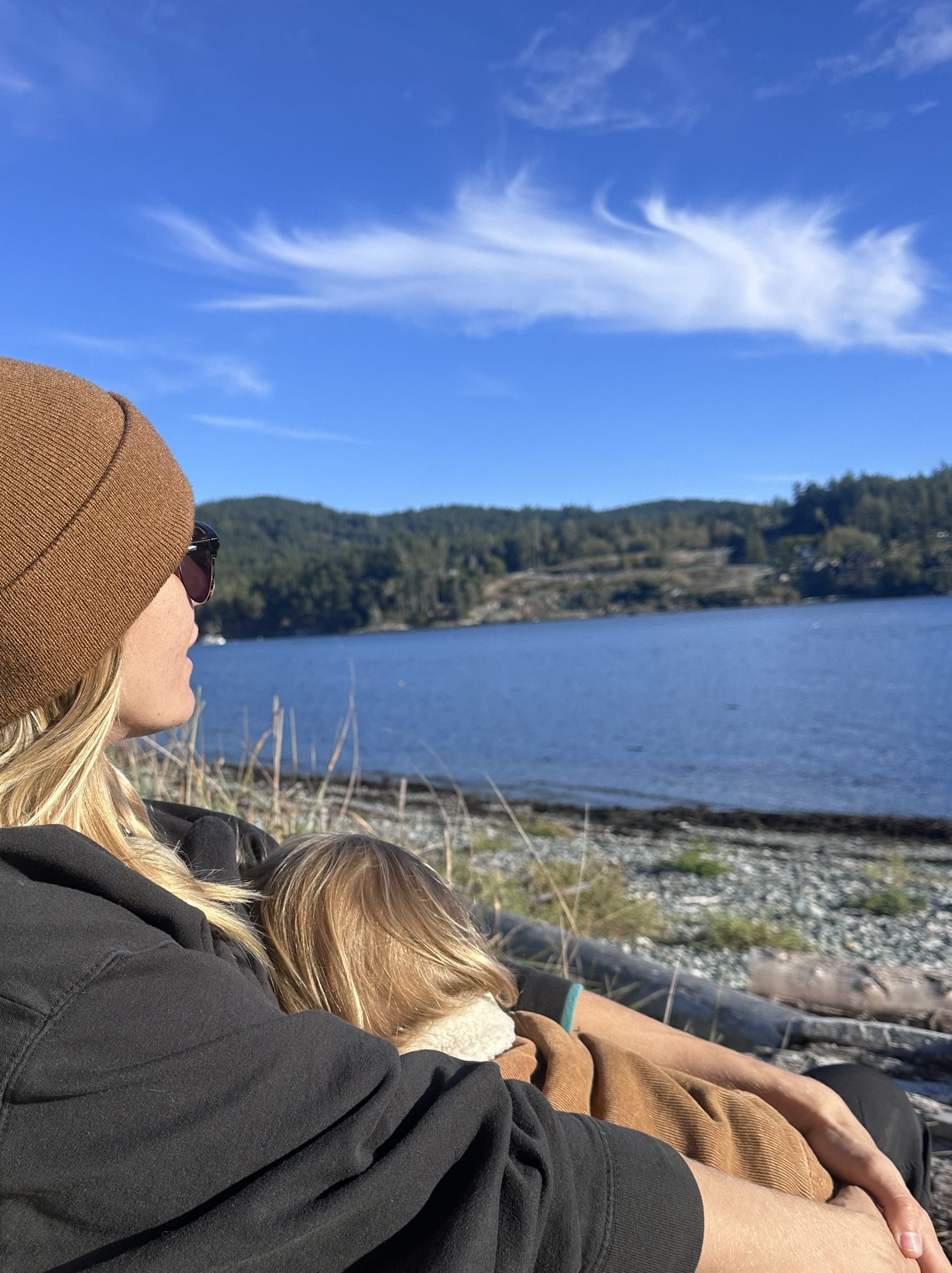 Kali, Sacred Roots Doula, smiling outdoors in Victoria BC